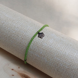 Cooperative de Creation/Green glass bead with silver flower bracelet - OBEIOBEI