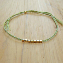 Load image into Gallery viewer, Cooperative de Creation/Two Unisex gold bead bracelets - OBEIOBEI